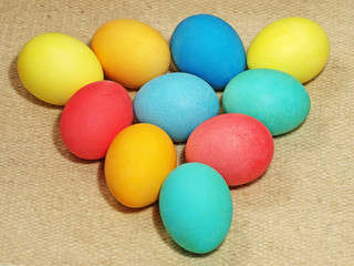 Multicolored easter eggs on a wool background.