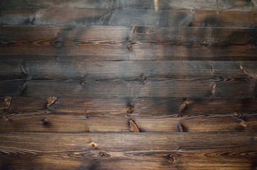 Naklejka premium Dark brown wooden background