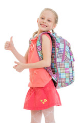Cheerful little girl with a backpack,