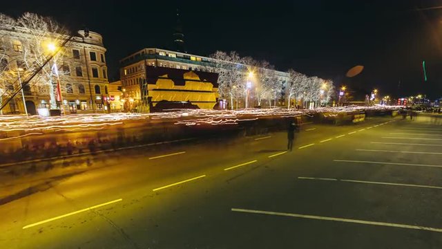 Long exposure night time lapse of a torchlight procession in Riga, Latvia during National Independence day
