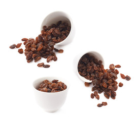 Cup filled with raisins isolated