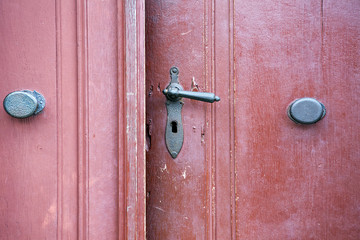 old wooden entrance door with antique door handle