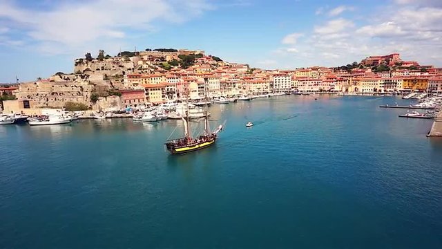 Napoleon boat in the sea in front of Elba island wide shot aerial footage