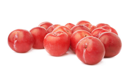 Pile of multiple red plums isolated