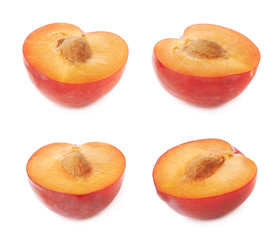Cut open plum half isolated