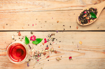Herbal tea in a spoon and a glass
