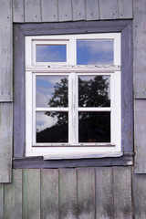 Obraz na płótnie Canvas window of an old wooden house