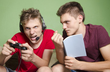 Older brother cant study from the noisy young brother who plays video game