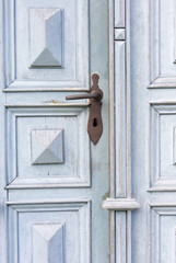 old wooden entrance door with antique door handle