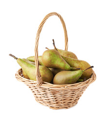 Wicker basket filled with pears isolated