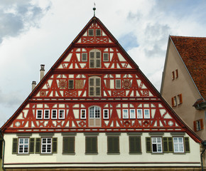 House with a red sun blind