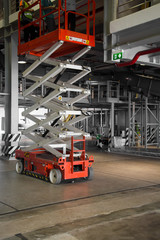 Fototapeta premium warehouse hall with hydraulic scissors lift