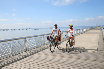 Family on a biking journey by the sea