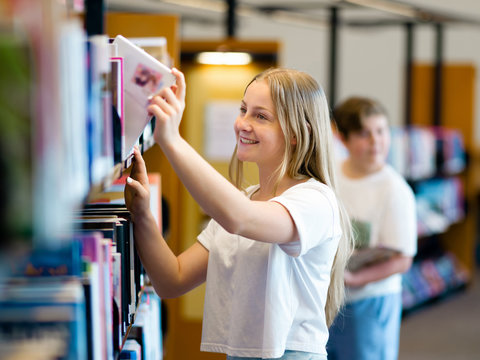 Teenage girl in library