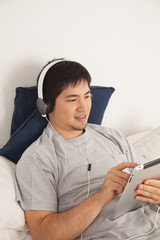 Man listening to music with the tablet