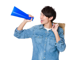 Asian man using megaphone for announcement about the shopping di