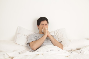 Man blowing his nose