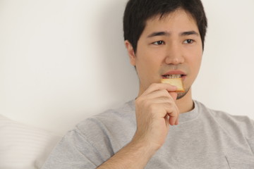 Man eating a toast