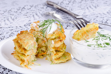 stack of pancakes vegetable, cut with a piece on a fork