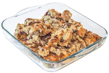 Chicken Legs, marinated in Wine, with minced Onion and Garlic, baked in square Glass Dish, Isolated On White Background.