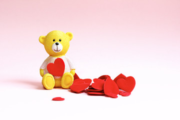 Teddy bear and a lot of hearts. Background for valentine or wedd