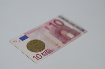 Ten euro banknote and old 100 drams