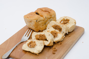 dried shredded pork bread on cutting board on a white background