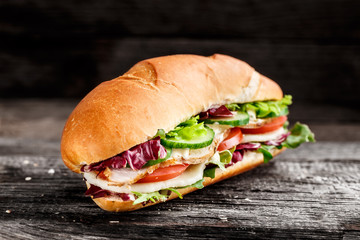 Sandwich with chicken, cheese and vegetables