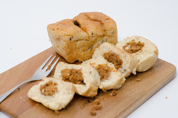 dried shredded pork bread on cutting board on a white background