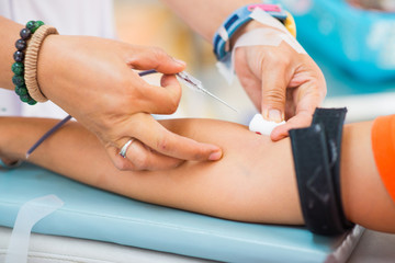 donating blood in a hospital room