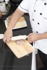 Chef making hamburger patty