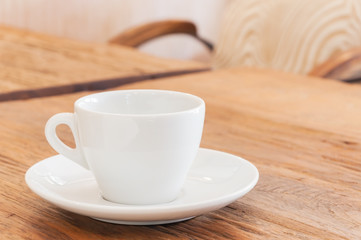 White coffee cup on wood table