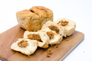 dried shredded pork bread on cutting board on a white background