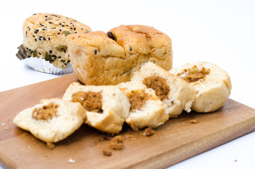 dried shredded pork bread on cutting board on a white background