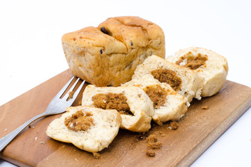 dried shredded pork bread on cutting board on a white background