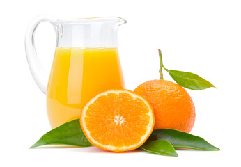 Orange fruits and jug of juice