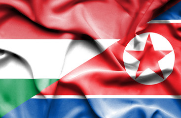 Waving flag of North Korea and Hungary