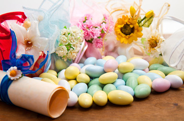  sugared almonds color blue, rose,  yellow  and white.