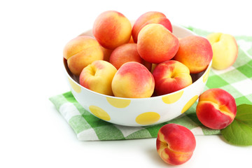Fresh apricots in bowl on a white background