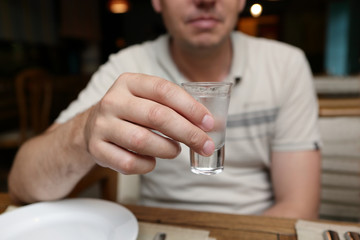 Fototapeta na wymiar Man with glass of vodka