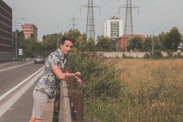 Fototapeta premium Young handsome man posing in the street