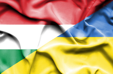 Waving flag of Ukraine and Hungary
