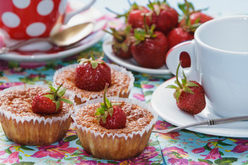 Cups and cakes with strawberries