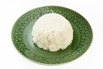 Rice on green plate isolated on white background