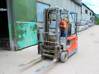 Forklift with paving slabs