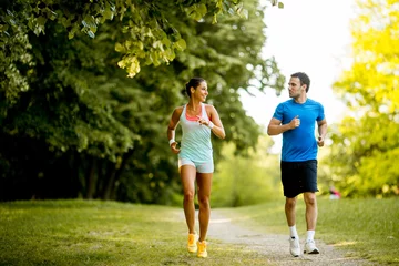 Wall murals Jogging Young couple running