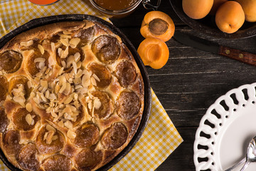 Homemade apricot tart with almonds and fresh fruits