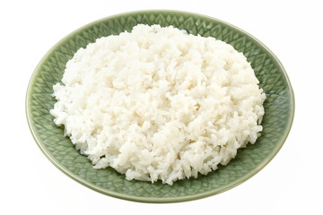 Rice on green plate isolated on white background