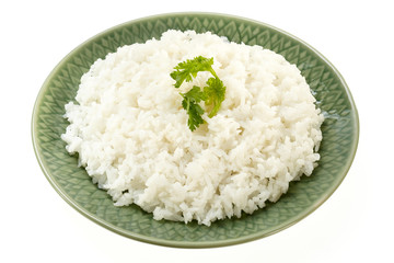 Rice on green plate isolated on white background
