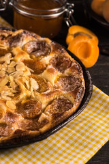 Homemade apricot tart with almonds and fresh fruits
